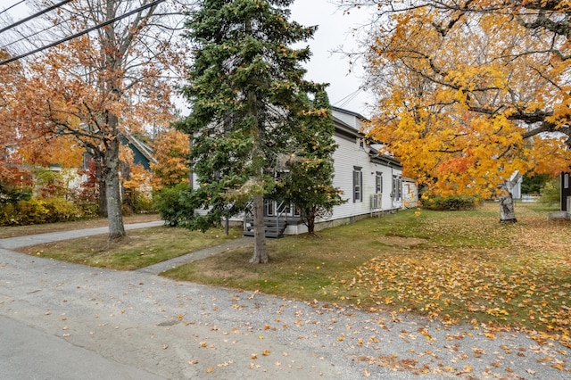 view of home's exterior featuring a yard