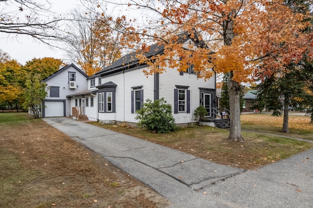 view of front of house featuring a garage and a front yard