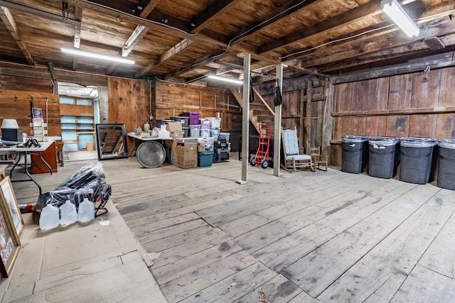 misc room featuring wood ceiling and wooden walls