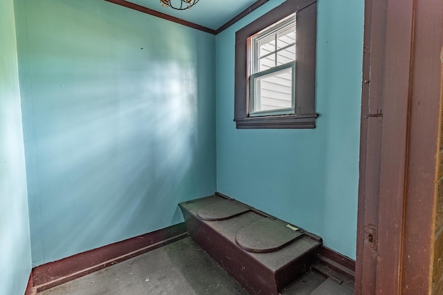 unfurnished room featuring ornamental molding