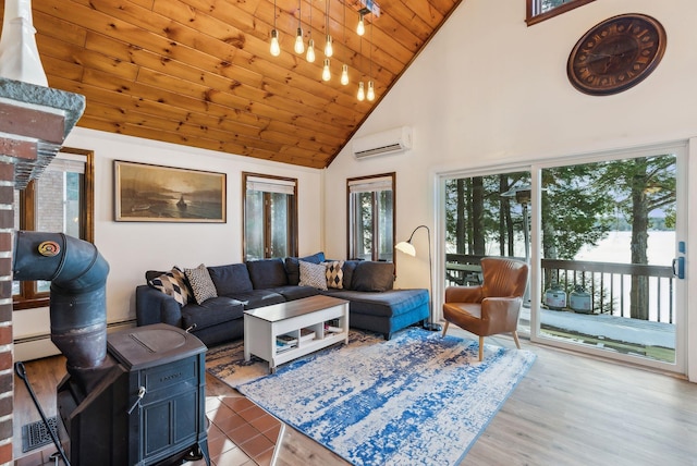 living room with a wall mounted air conditioner, wood ceiling, light hardwood / wood-style flooring, and high vaulted ceiling