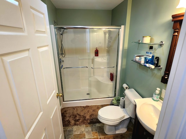 305 Fuller Rd, Easton, ME 04740 - bathroom with vanity, toilet, a shower stall, and stone finish floor