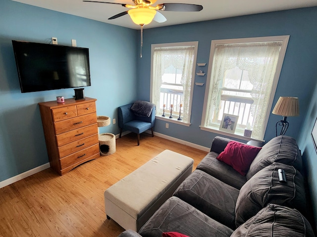 305 Fuller Rd, Easton, ME 04740 - living room with a ceiling fan, baseboards, and light wood-type flooring