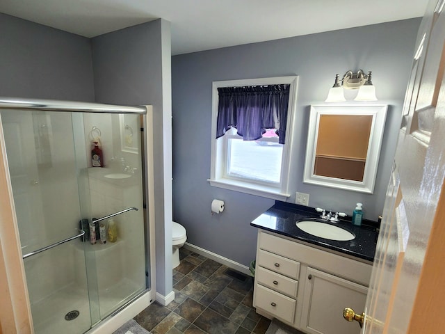305 Fuller Rd, Easton, ME 04740 - full bathroom with vanity, a stall shower, baseboards, and stone finish flooring
