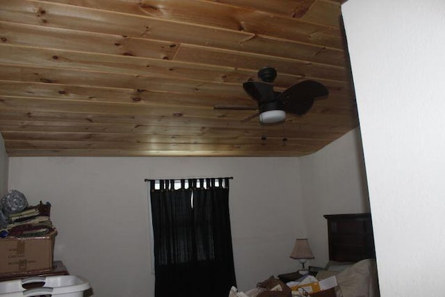 bedroom with lofted ceiling and wood ceiling