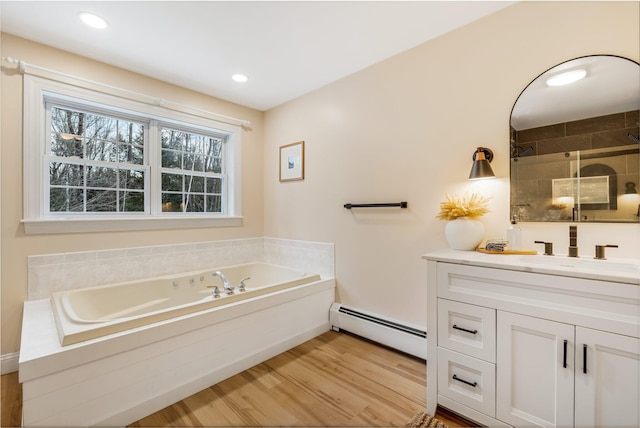 bathroom with baseboard heating, wood-type flooring, vanity, and independent shower and bath