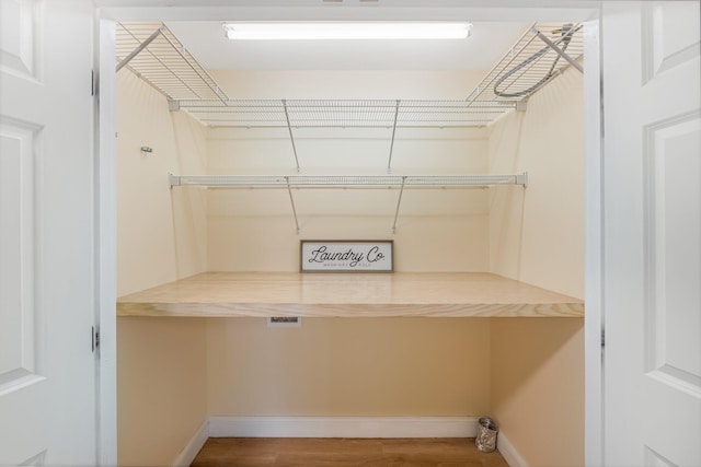 washroom with hardwood / wood-style floors