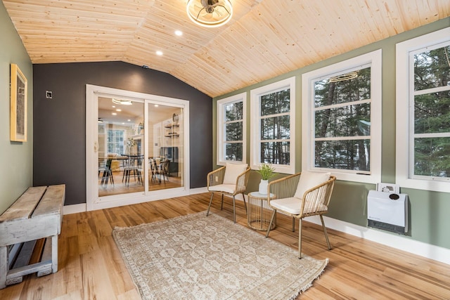 sunroom featuring heating unit, wood ceiling, and vaulted ceiling