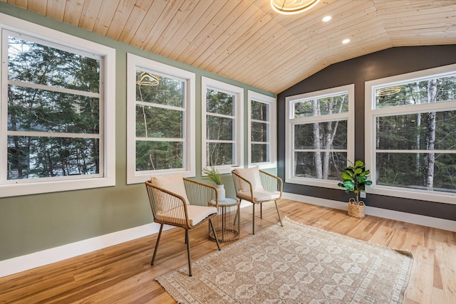 sunroom / solarium featuring wood ceiling and lofted ceiling