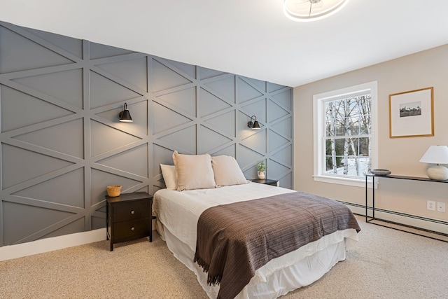 bedroom featuring baseboard heating and carpet floors