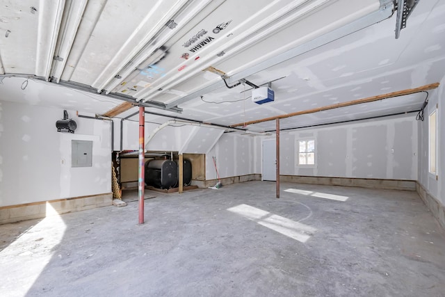 garage featuring a garage door opener and electric panel