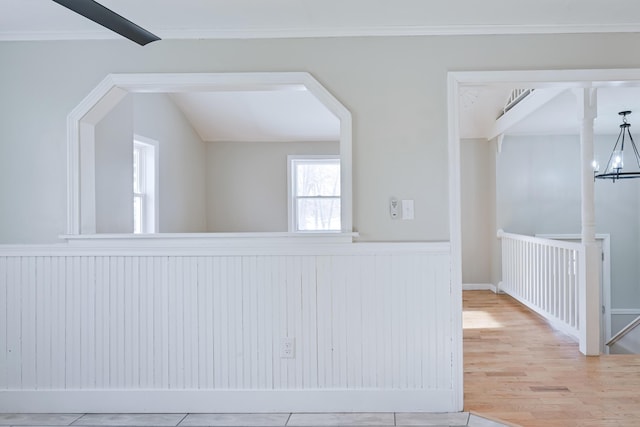 interior space with lofted ceiling, wood-type flooring, and a chandelier