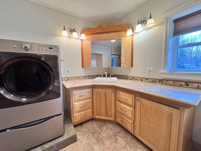 bathroom with washer / clothes dryer, ornamental molding, and vanity