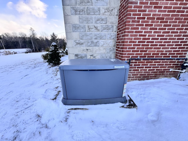 exterior details with a power unit and brick siding