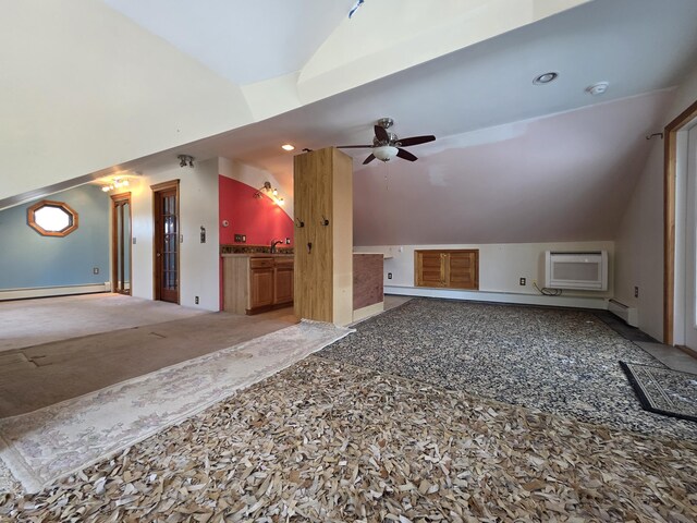 additional living space featuring lofted ceiling, baseboard heating, a wall mounted air conditioner, and a ceiling fan