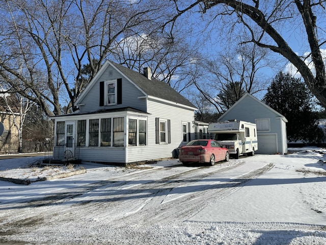 view of front of property featuring a sunroom