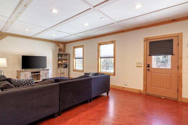 living room featuring coffered ceiling and concrete floors