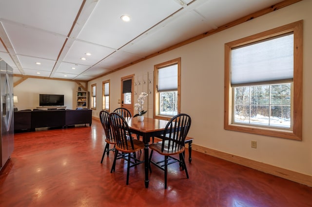 dining area featuring concrete floors