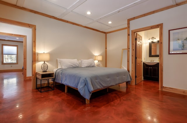 bedroom with coffered ceiling, ensuite bathroom, concrete flooring, and sink