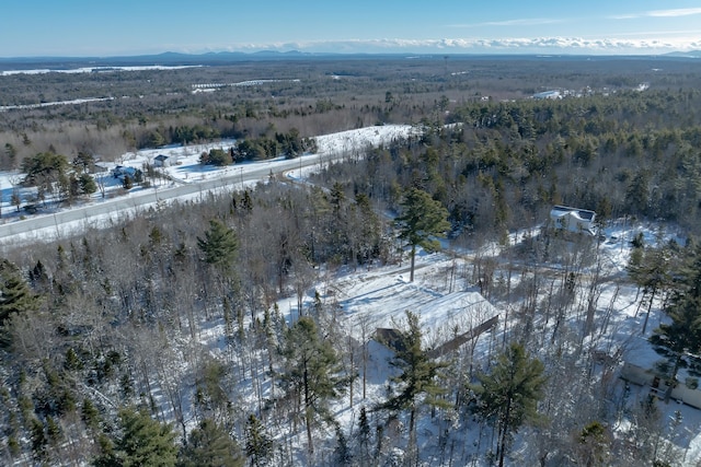 snowy aerial view with a mountain view