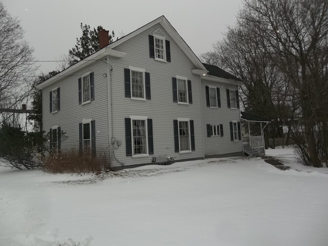 colonial home featuring a chimney