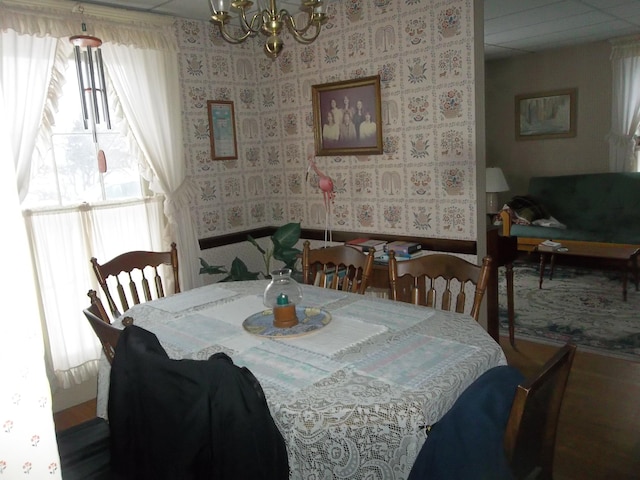 dining area featuring an inviting chandelier