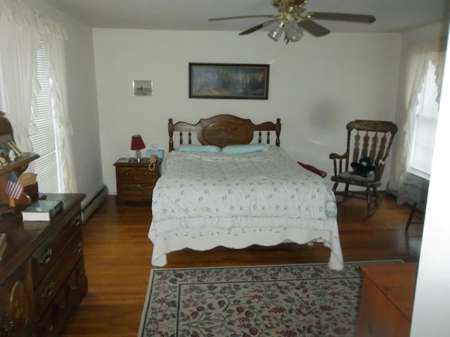 bedroom with ceiling fan and dark hardwood / wood-style flooring