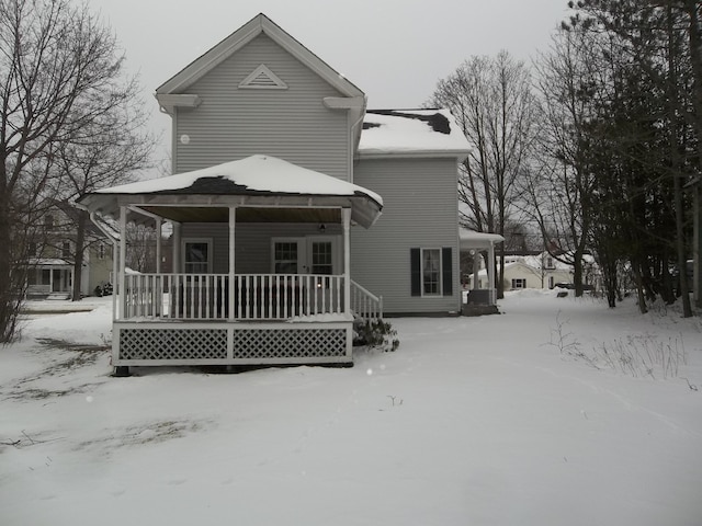 snow covered house with a gazebo