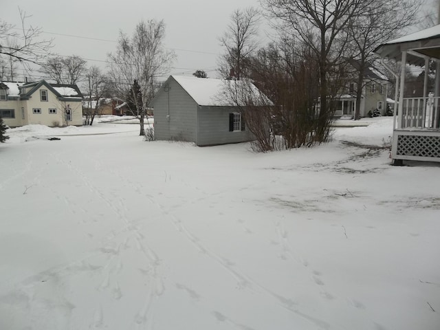 view of yard layered in snow