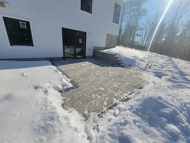 view of snow covered patio