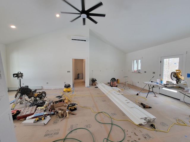 miscellaneous room featuring a wall mounted air conditioner and high vaulted ceiling