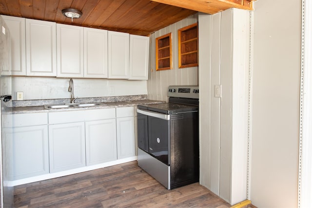 kitchen featuring white cabinetry, stainless steel electric range oven, and sink