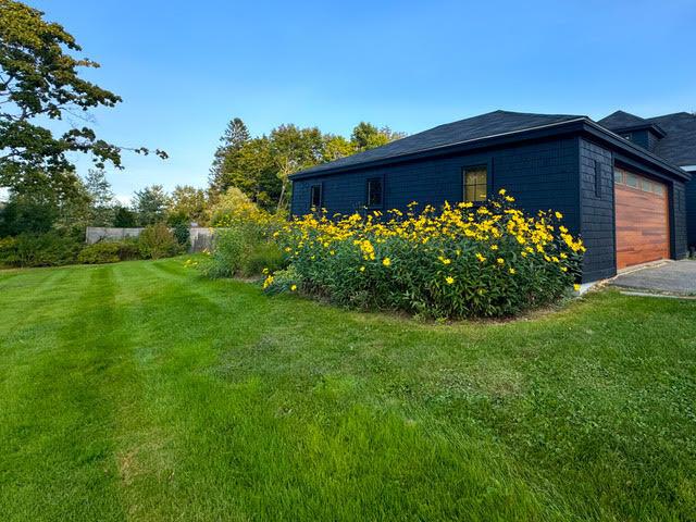 view of home's exterior with a lawn