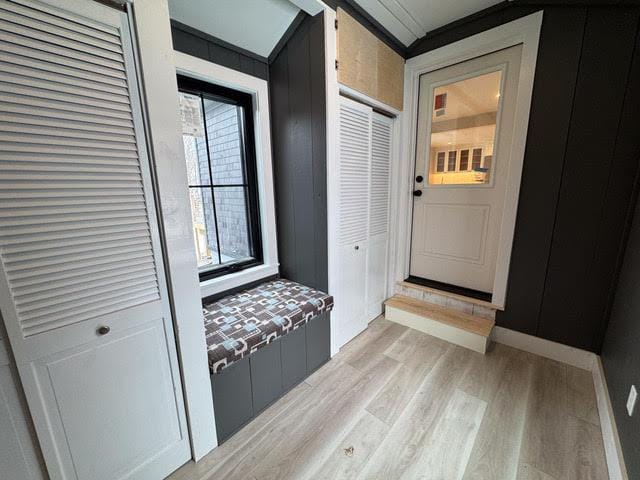 mudroom featuring crown molding and light hardwood / wood-style flooring