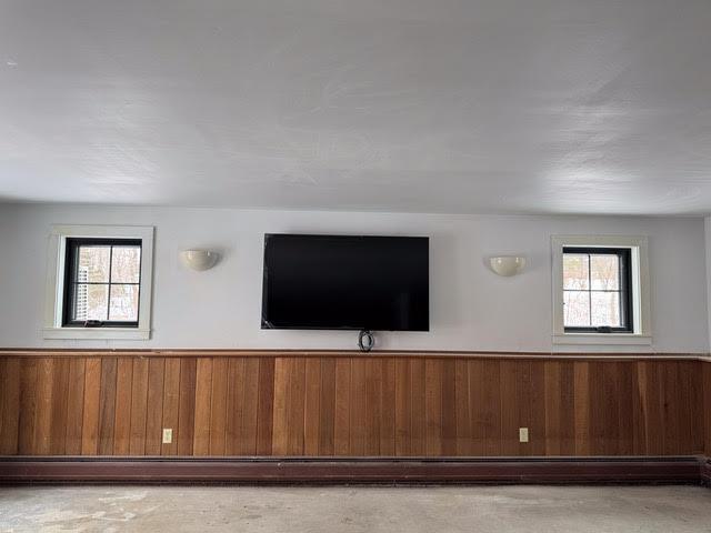 interior space featuring wood walls