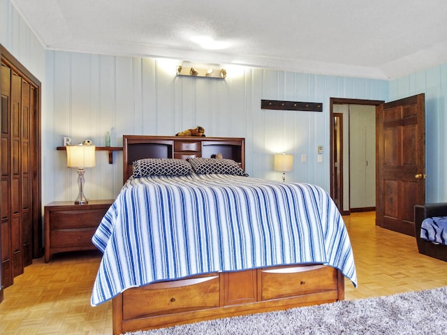 bedroom featuring light parquet flooring