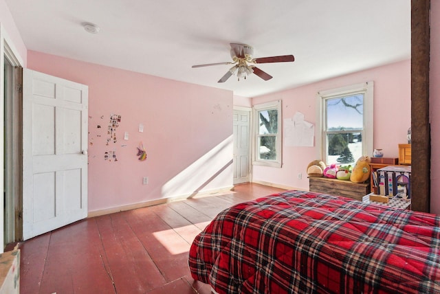 bedroom with ceiling fan and hardwood / wood-style floors