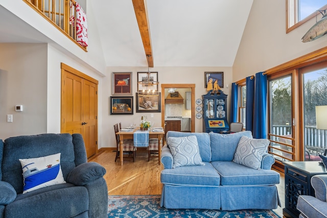 living room featuring hardwood / wood-style flooring, a high ceiling, and beamed ceiling