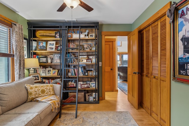 sitting room with ceiling fan, light hardwood / wood-style flooring, and a wealth of natural light