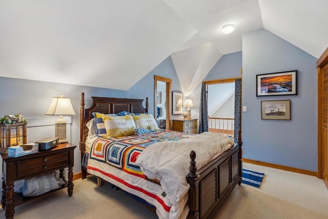 bedroom featuring lofted ceiling and light colored carpet