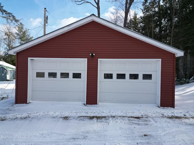 view of snow covered garage