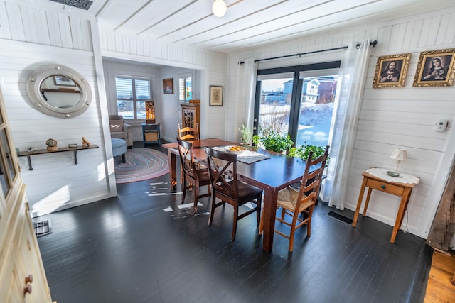 dining space with dark hardwood / wood-style flooring