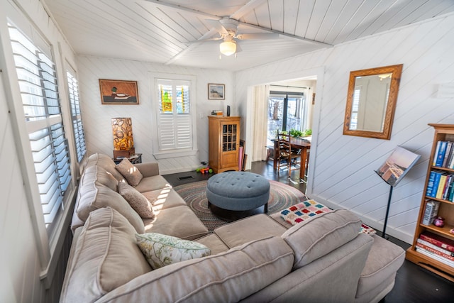 living room with ceiling fan, wood-type flooring, and wood ceiling