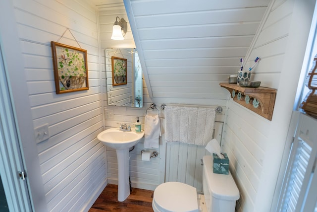 bathroom featuring sink, hardwood / wood-style floors, and toilet