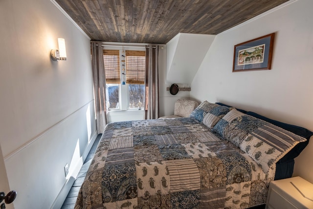 bedroom featuring hardwood / wood-style floors and wood ceiling