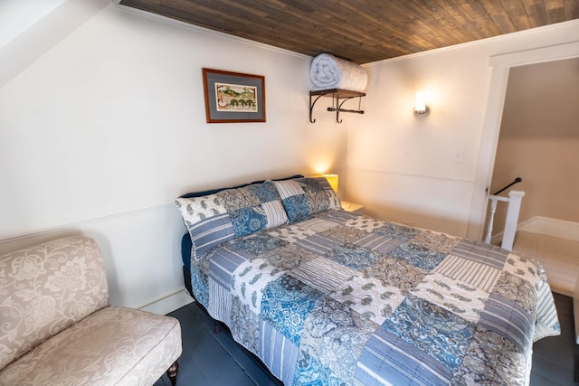 bedroom featuring crown molding and wood ceiling