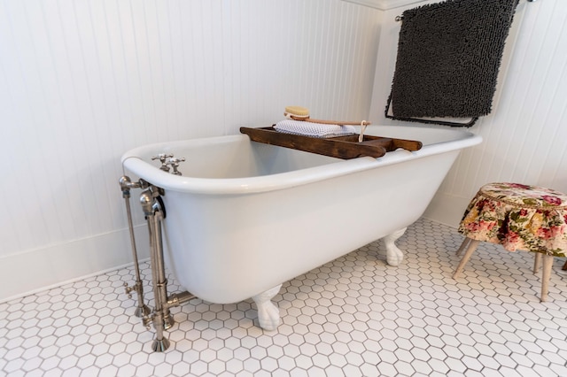 bathroom with tile patterned flooring and a bathtub