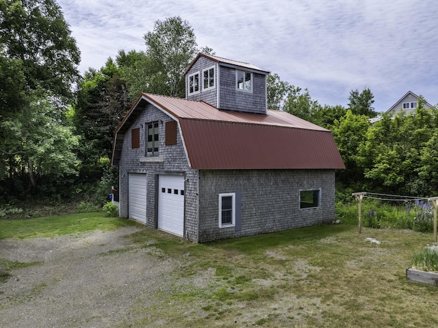 194 Water St, Eastport, ME 04631 - garage featuring a garage and view of wooded area