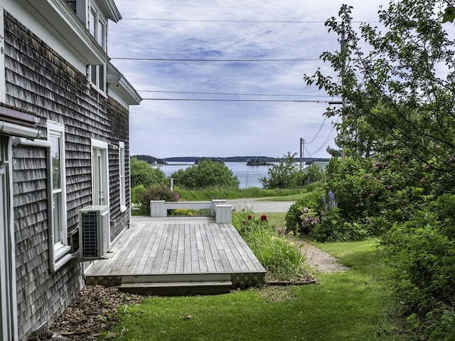194 Water St, Eastport, ME 04631 - view of green lawn featuring a deck with water view and cooling unit