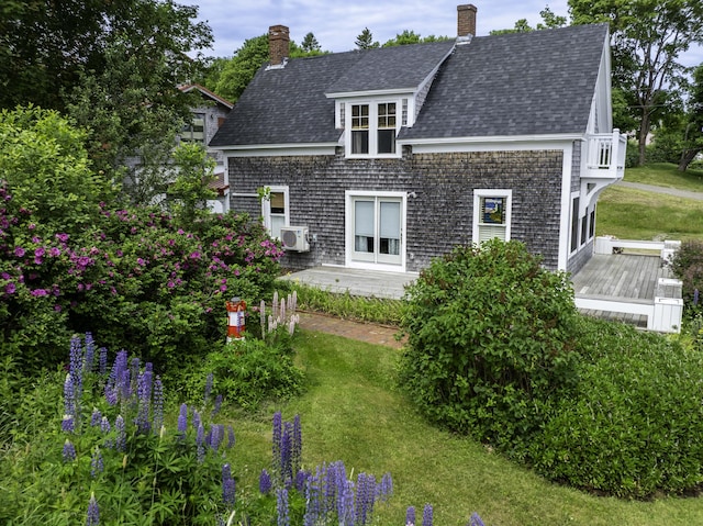 194 Water St, Eastport, ME 04631 - back of property with a lawn, a shingled roof, a chimney, and a deck